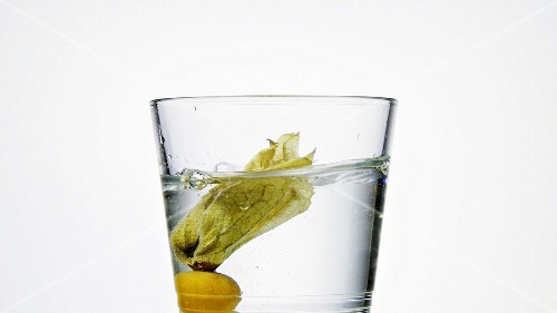 Physalis falling into a glass of water