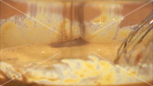 Mixing pumpkin puree with cinnamon (for pumpkin pie)