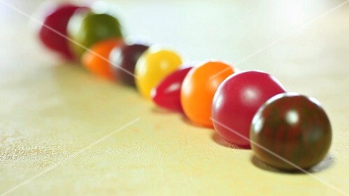 Various types of tomatoes in a row