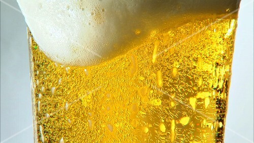 Pouring a glass of beer (detail)