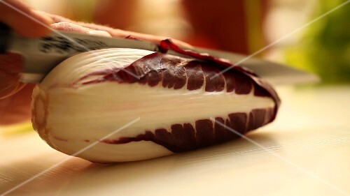 Cutting a radicchio in half