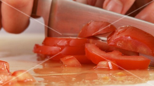 Tomatoes being diced
