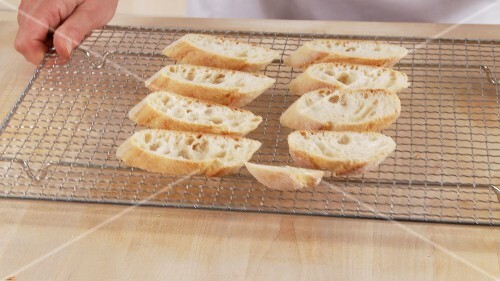 Ciabatta slices on an oven rack