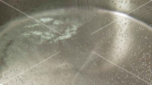 Salt being added to water