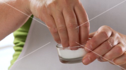 Salt and water being added to gnocchi