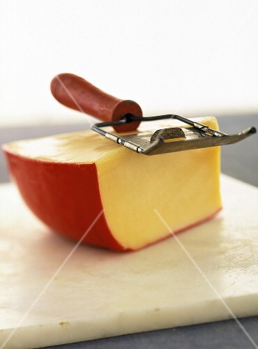 A Wedge of Gouda Cheese with Slicer