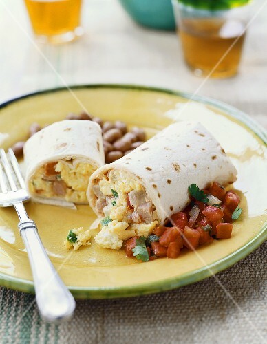 An Egg and Ham Breakfast Burrito with Salsa and Beans