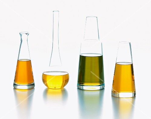 Four Glass Jars of Assorted Oils