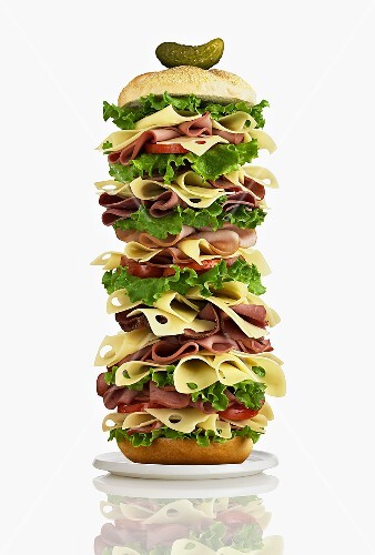 Giant club sandwich with ham, cheese and salad