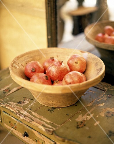 Pomegranates in a terracotta bowl
