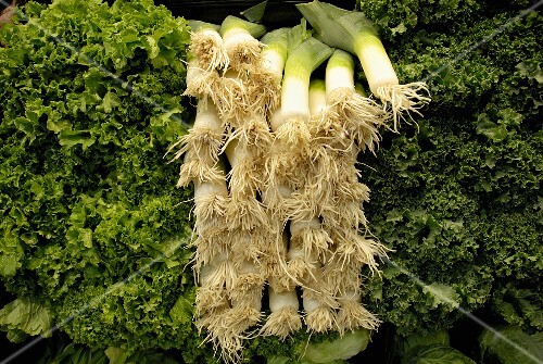 Leeks (root end) and greens at a market