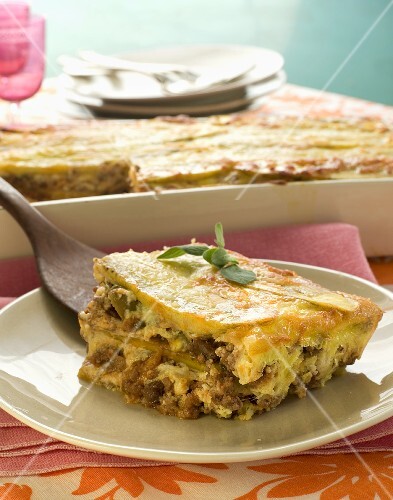 Piece of Plantain Lasagna on a Plate; Spatula