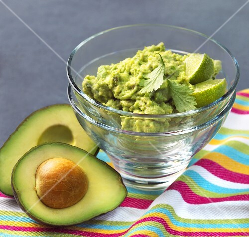 Classic Guacamole in a Glass Bowl; Fresh Avocados