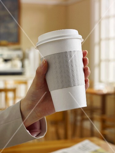 To Go Coffee Cup in Womans Hand