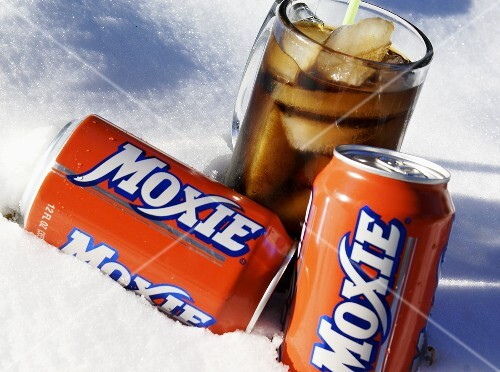 Glass and Two Cans of Moxie in the Snow
