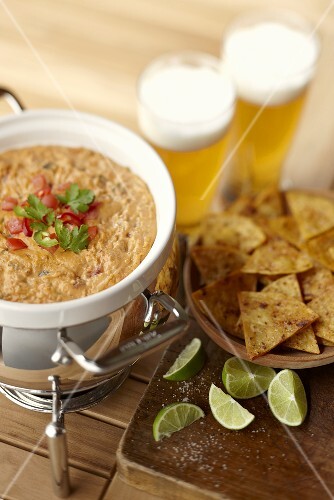 Salsa con queso dip with tortilla chips and beer (Mexico)