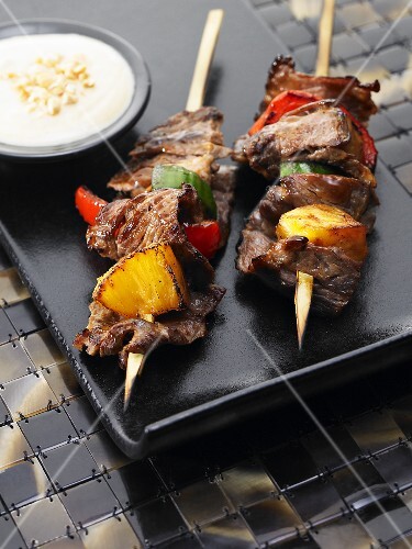 Indonesian beef skirt kebabs with pineapple, red peppers anda curry dip