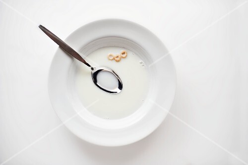 Empty Bowl with Cherrios Remains and Milk