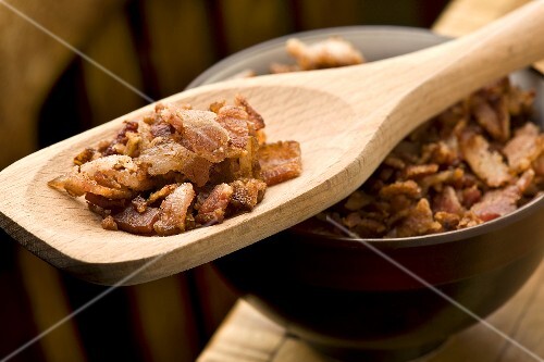 Bacon Bits in a Wooden Spoon; Bowl of Bacon Bits