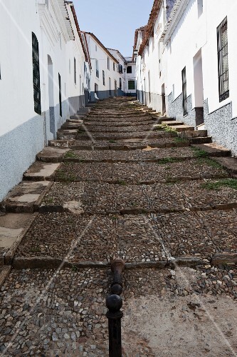 View up a cobbled street in the village of Aracena in Andalucia southern Spain