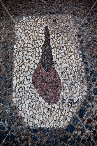 Detail of a stone mosaic of a leg of jamon de jabugo for which Andalucia is famous