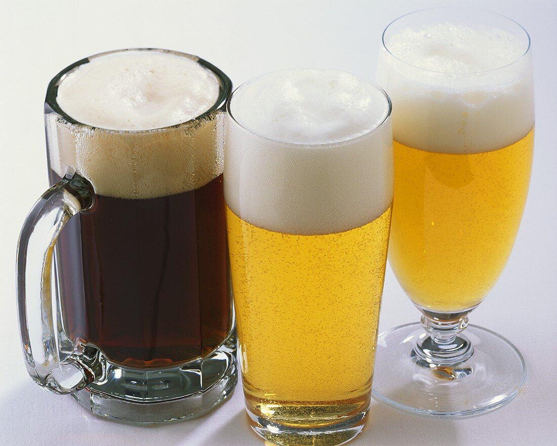 Three types of beer in glasses: Schwarzbier, Helles & Pils