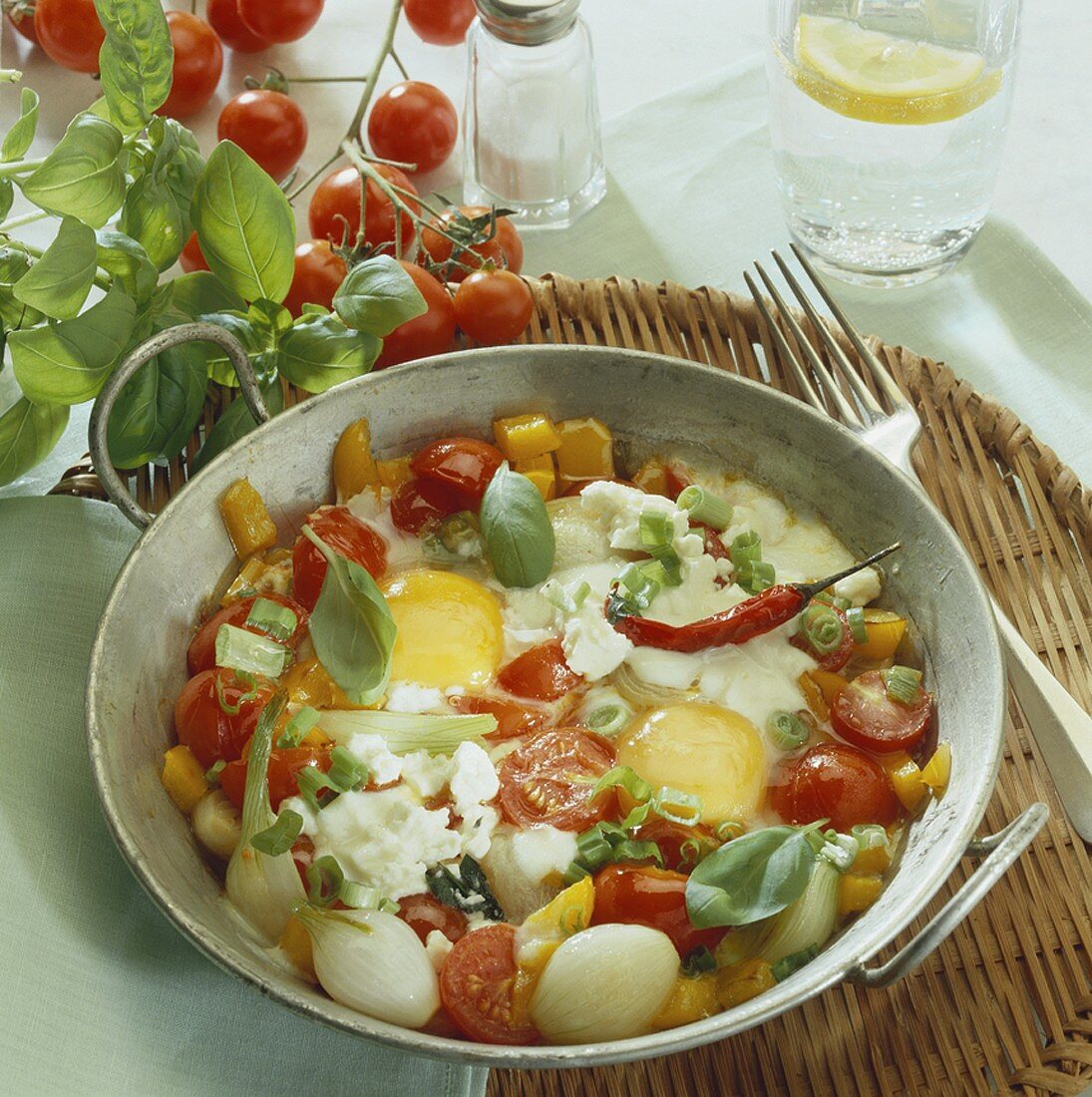 Pan-fried mixed vegetables with fried eggs and cheese
