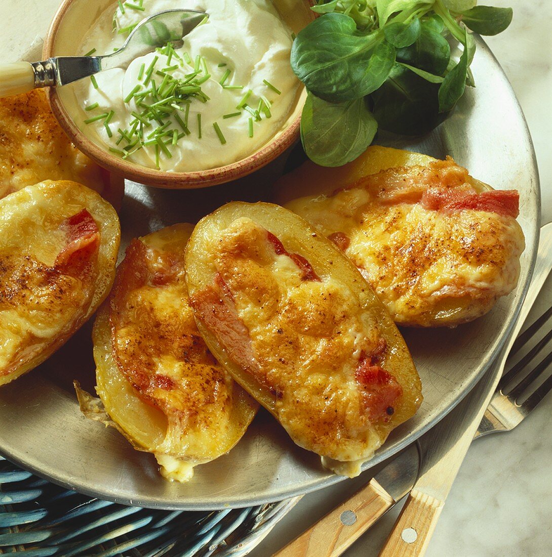 Baked potatoes with cheese and bacon topping