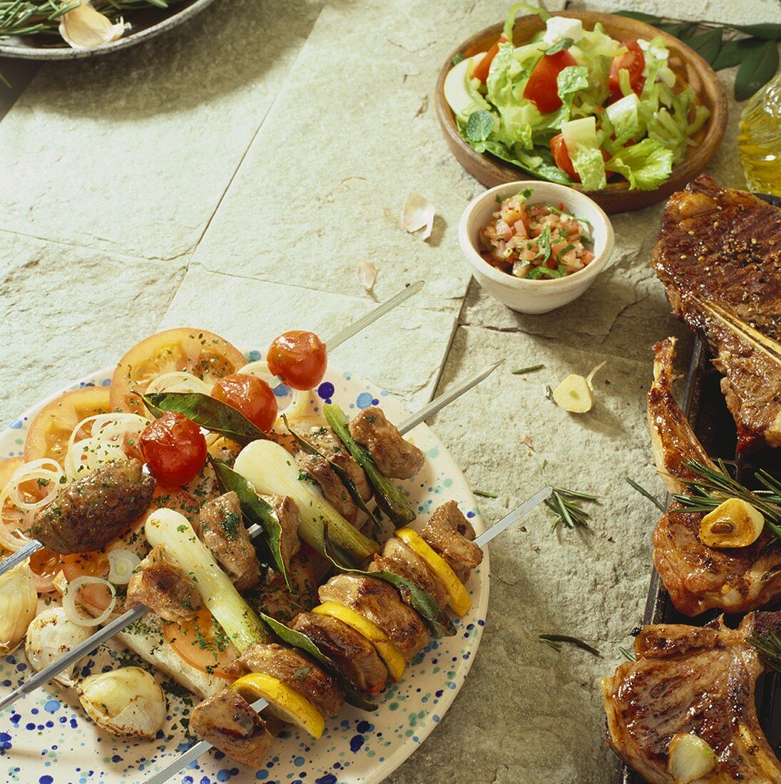 Grilled kebabs, meat and mixed salad