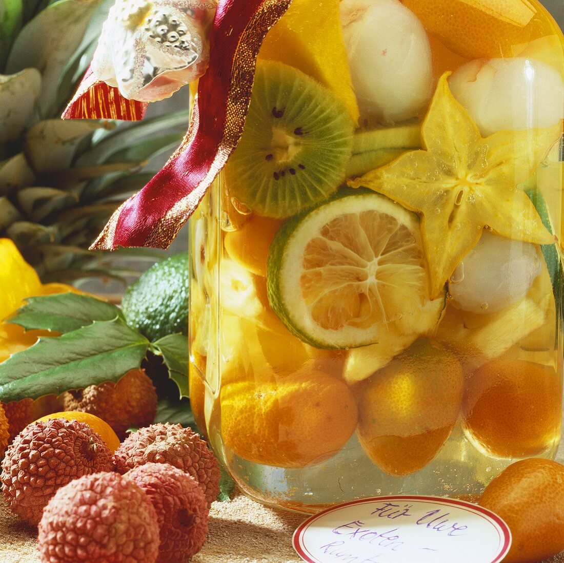 Rumtopf with exotic fruit in preserving jar