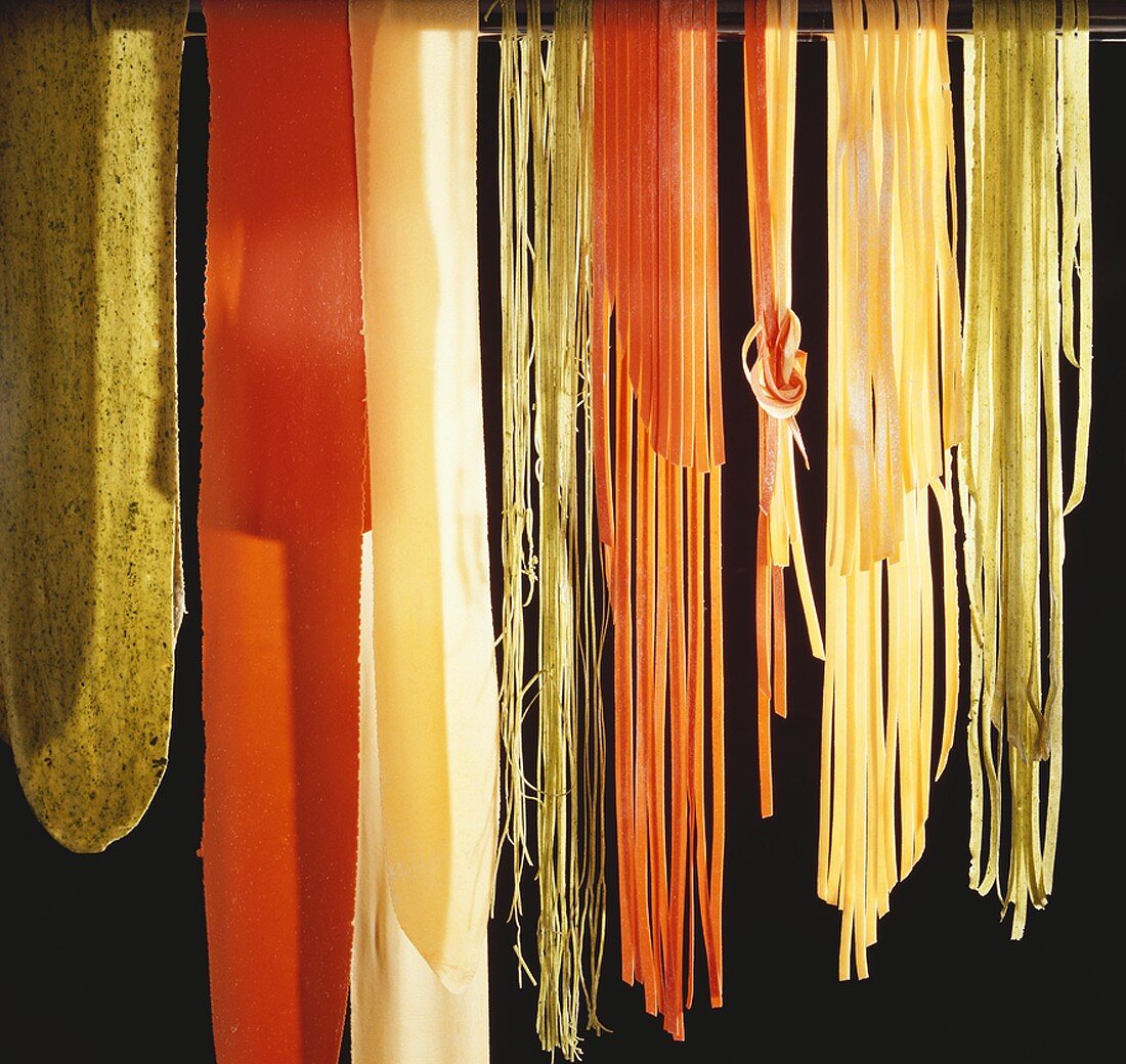 Coloured pasta against black background