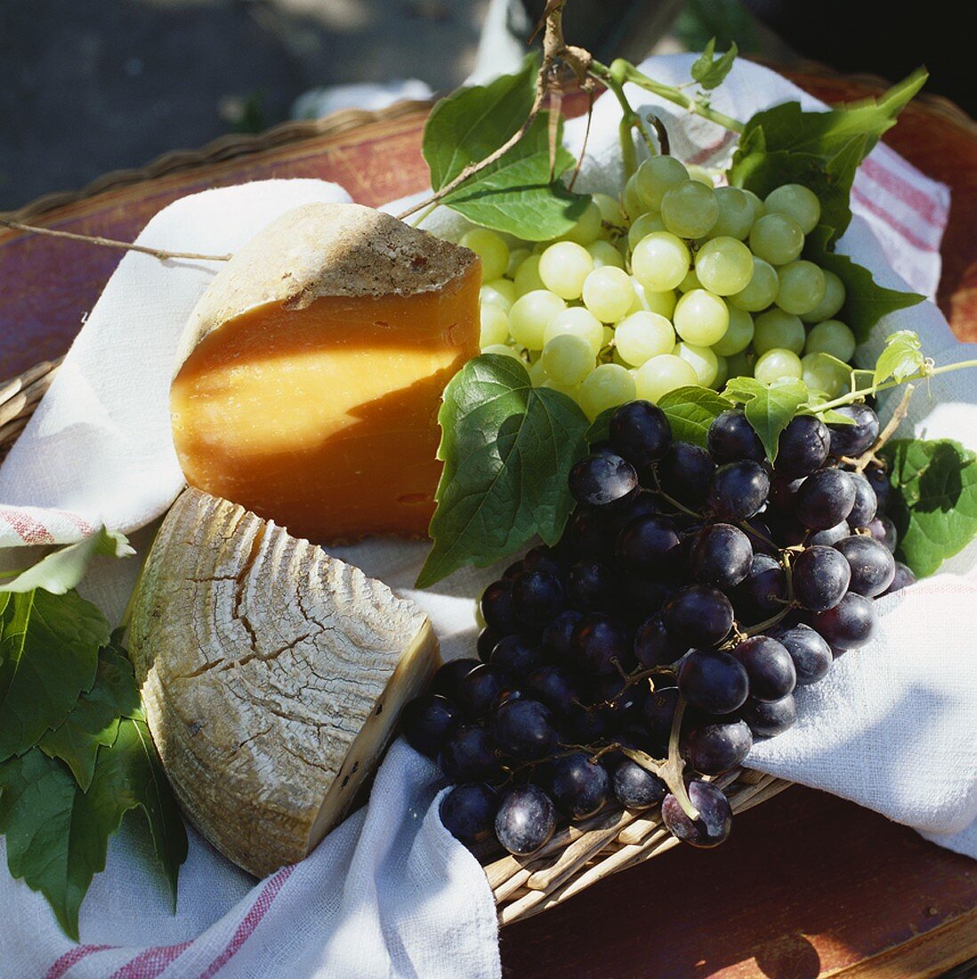 Still life with cheese and grapes