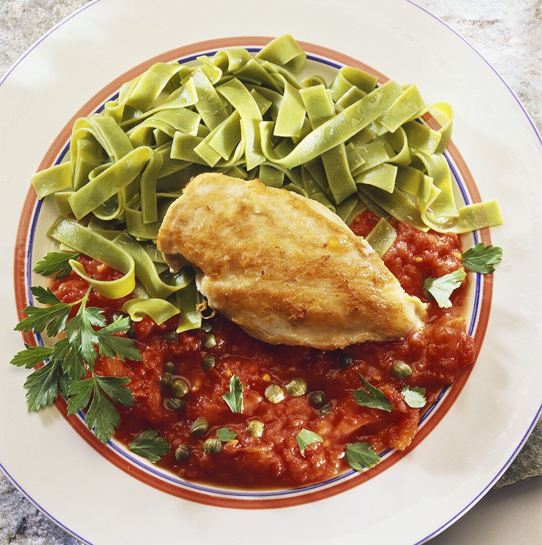 Chicken breast with ribbon pasta and tomato sauce