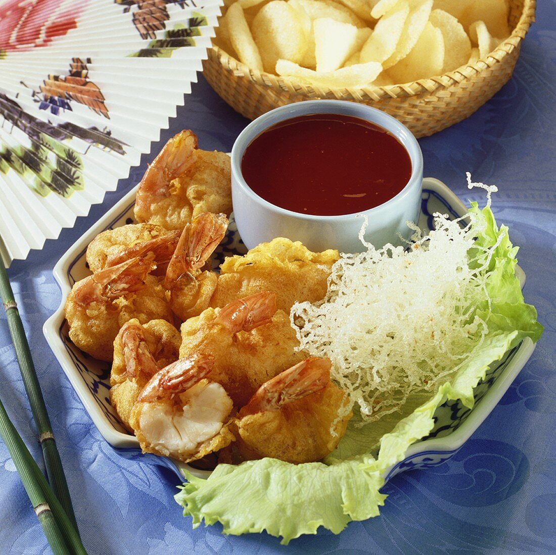 Prawns in batter with dip and deep-fried glass noodles