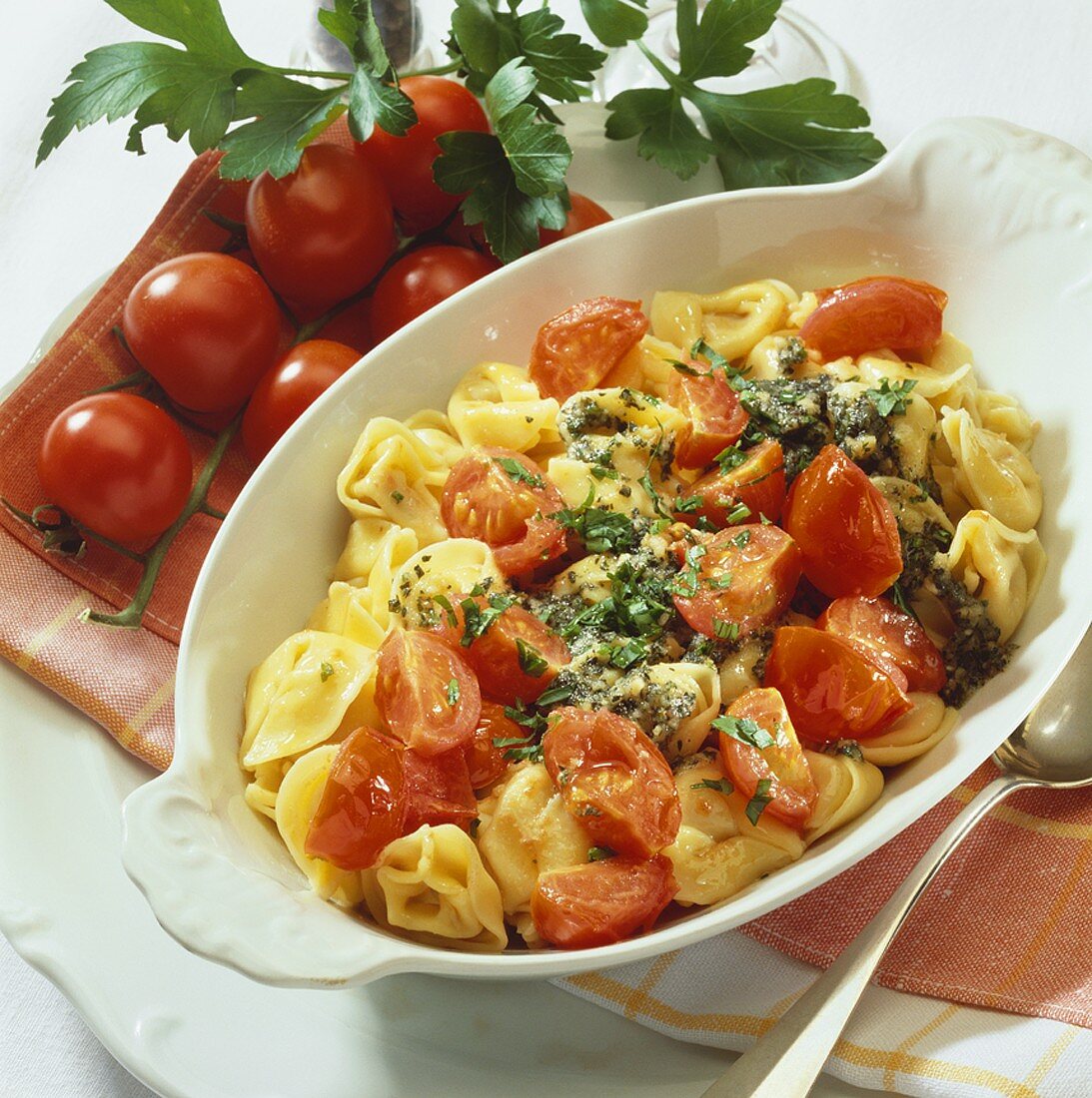 Filled cappalletti (hat-shaped pasta) with butter & tomatoes