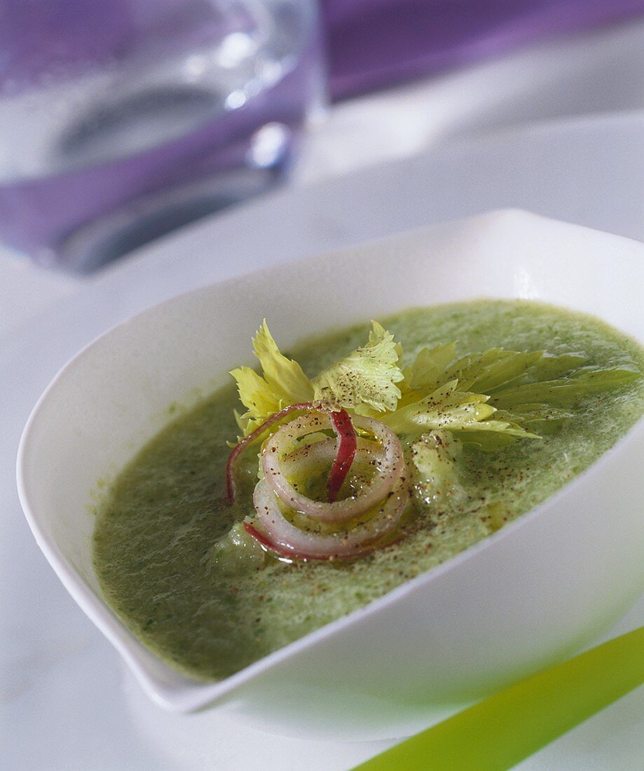 Green soup with onion rings