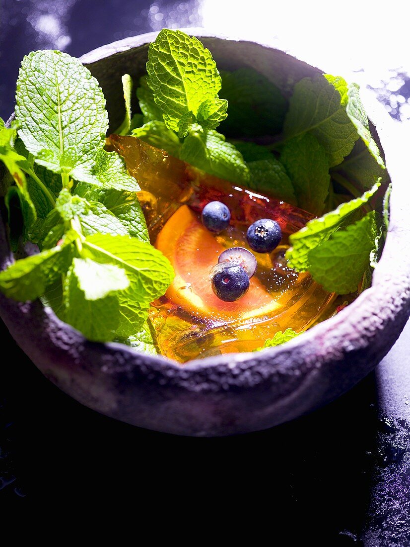 Grapefruit in aspic with berries and lemon balm