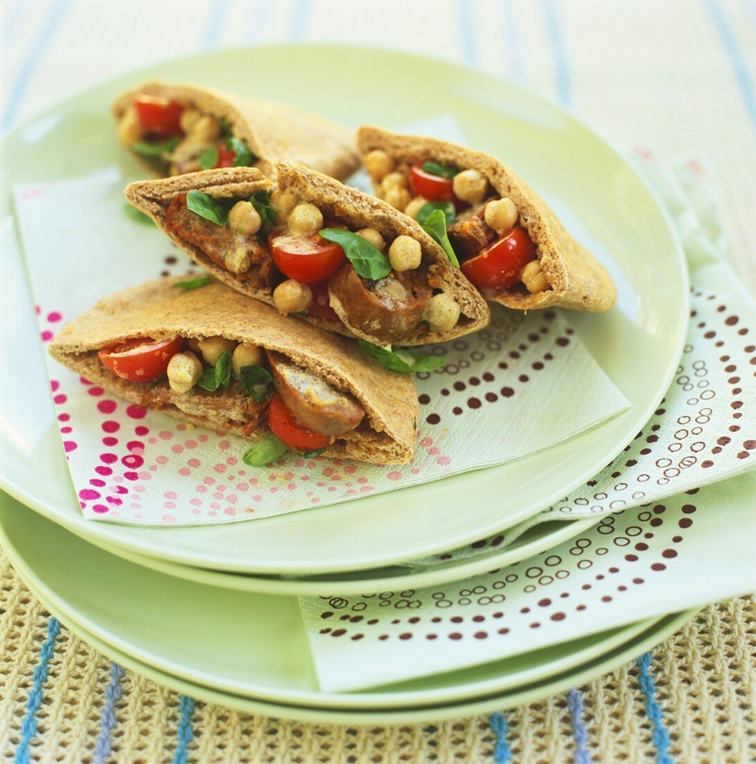 Pita bread filled with chick-peas, sausage and tomatoes