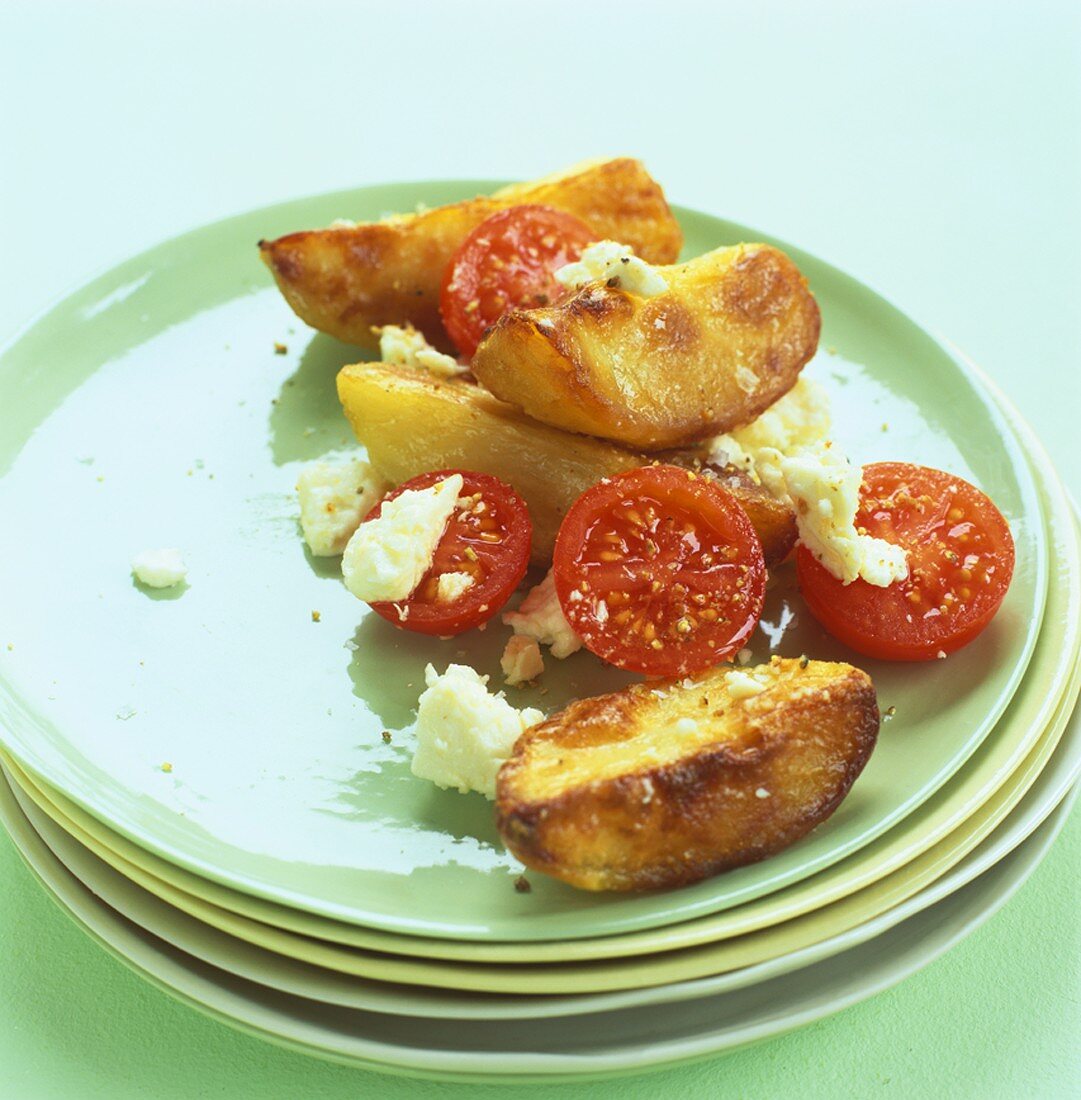 Roast potatoes with cherry tomatoes and feta