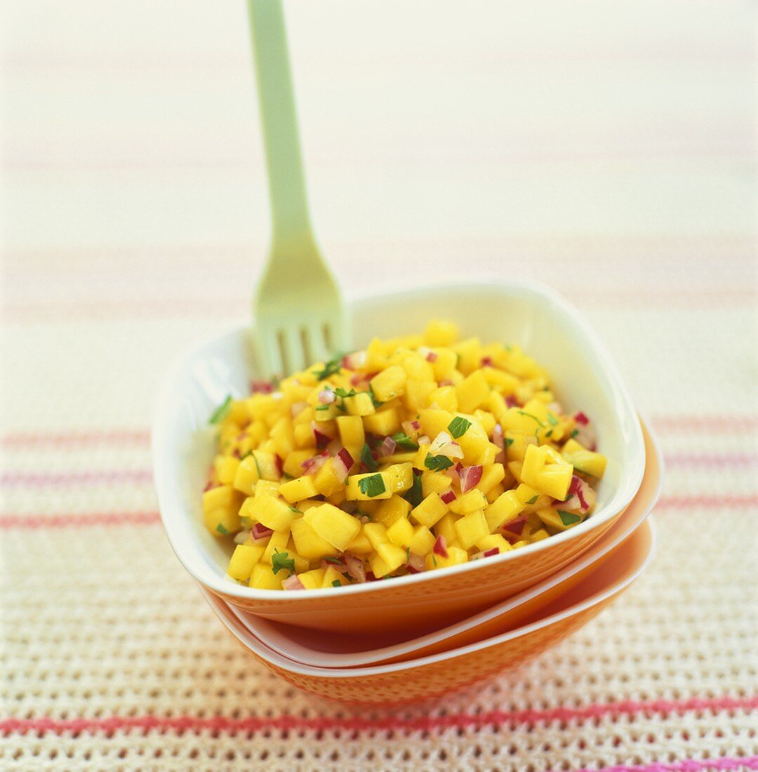 Mango salsa in a small dish