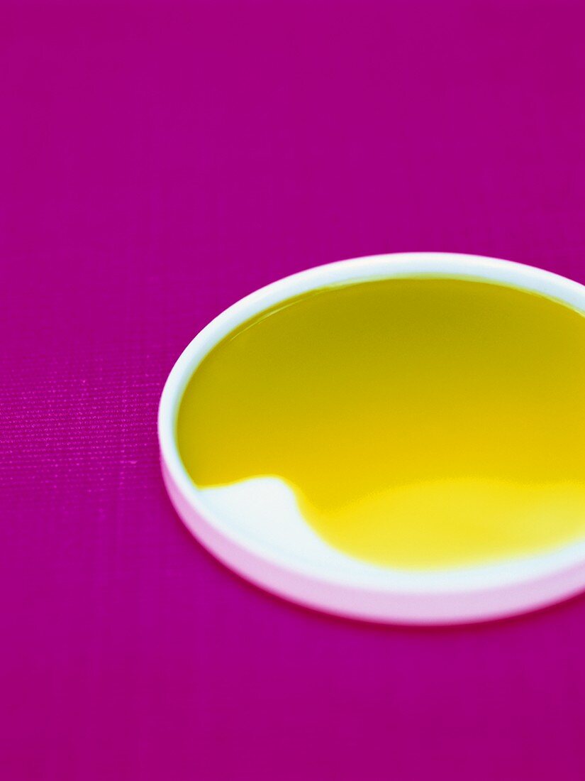 Pistachio oil in small white dish