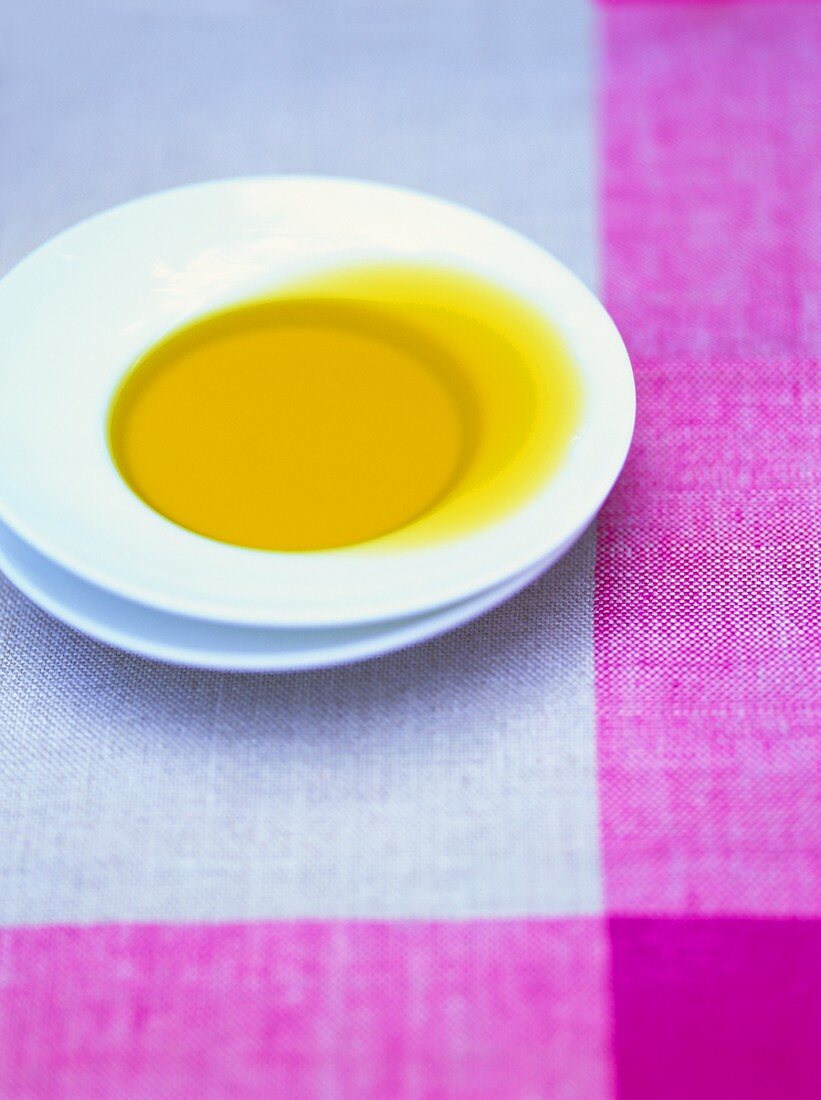 Olive oil in a white soup plate
