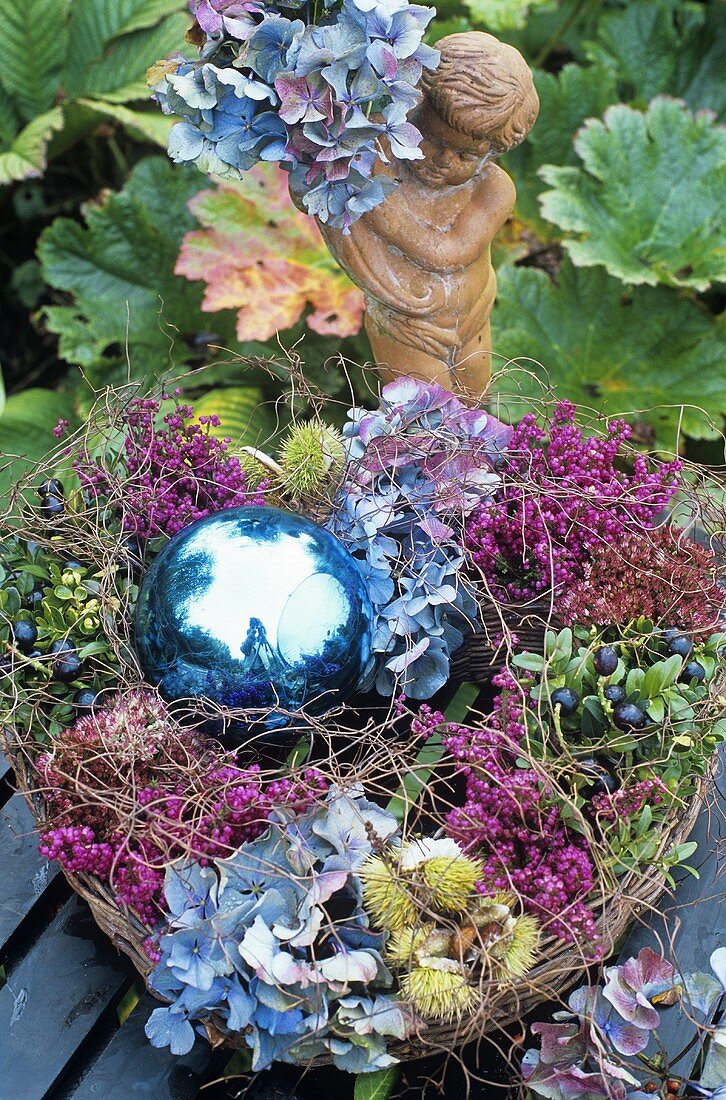 Autumnal arrangement with hydrangeas in willow wreath