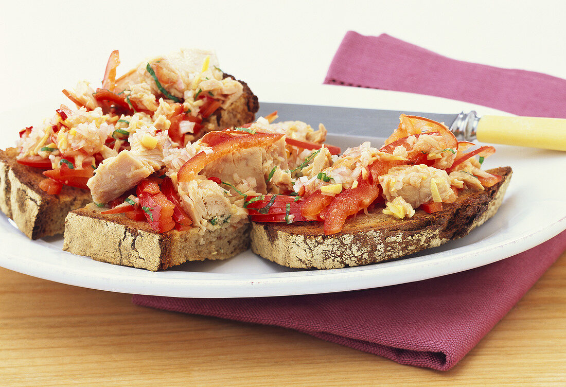 Toasted bread topped with tuna salad