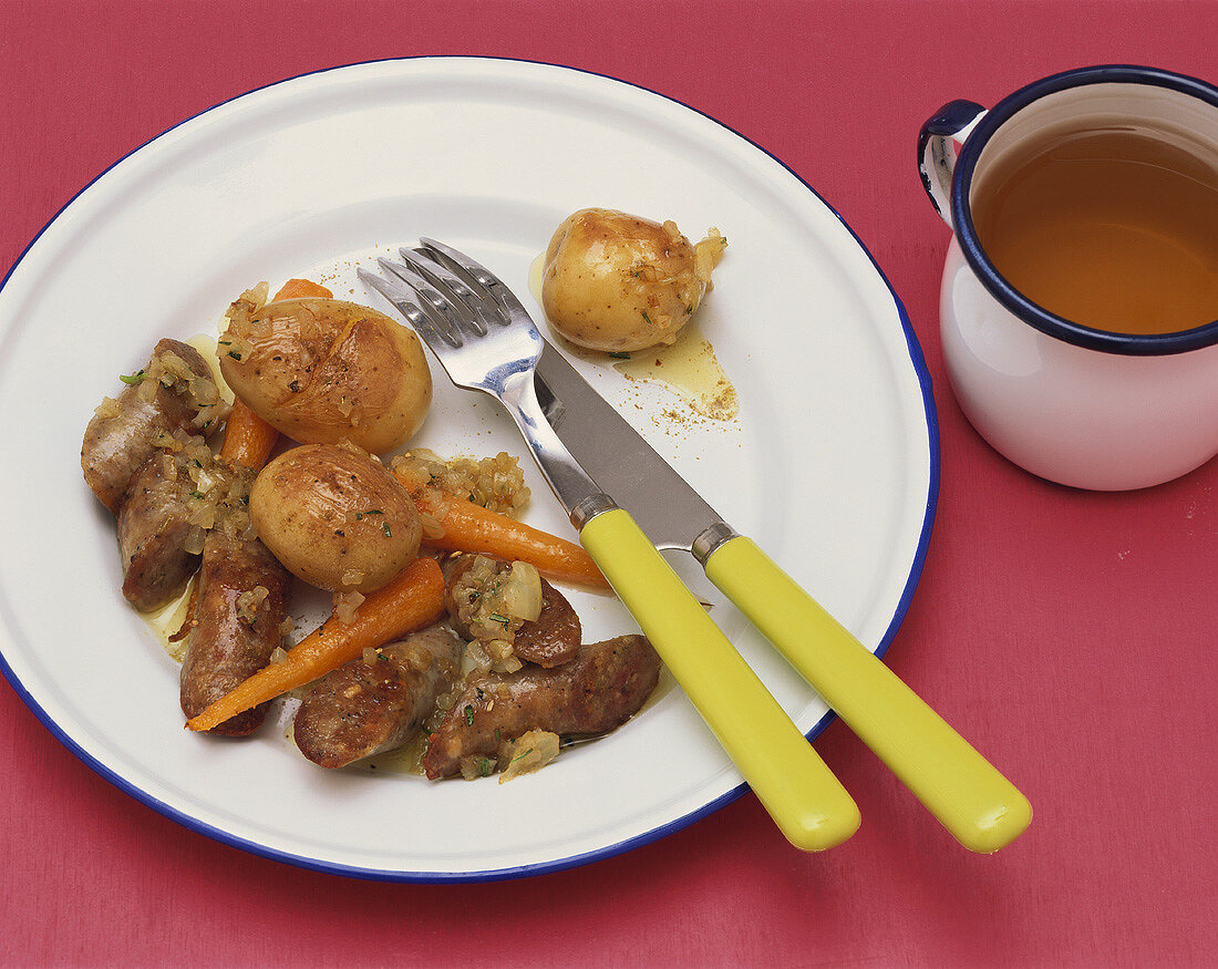 Lamb sausages with fried new potatoes and carrots