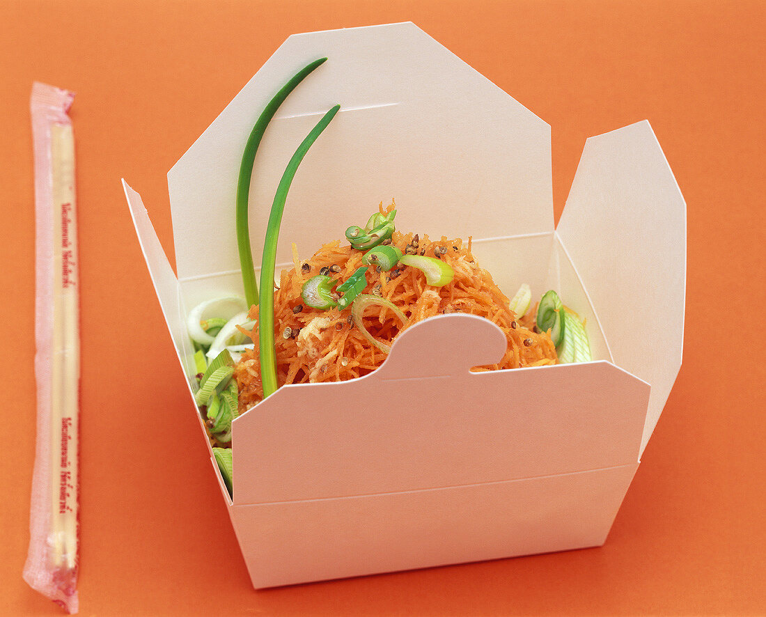 Carrot and ginger salad in a takeaway box