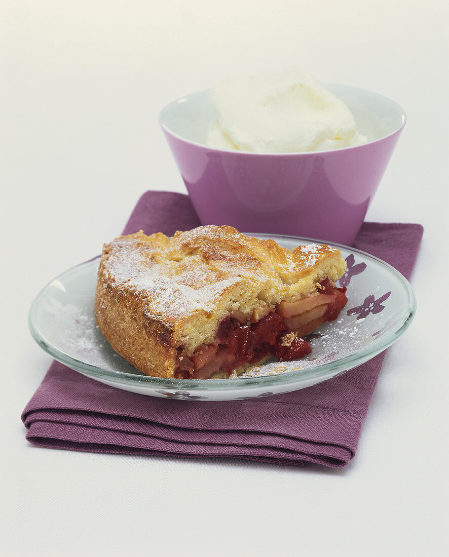 Cranberry and apple pie with cream