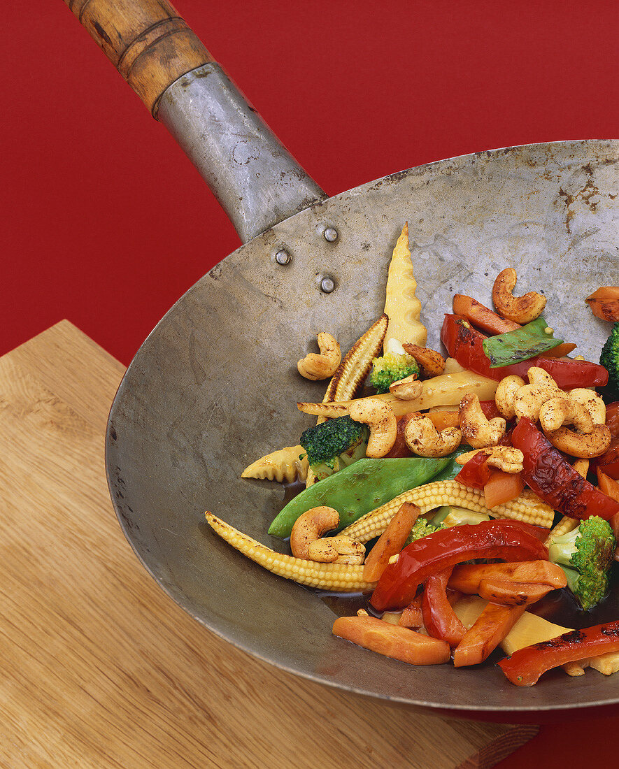 Vegetables and spicy cashew nuts cooked in a wok