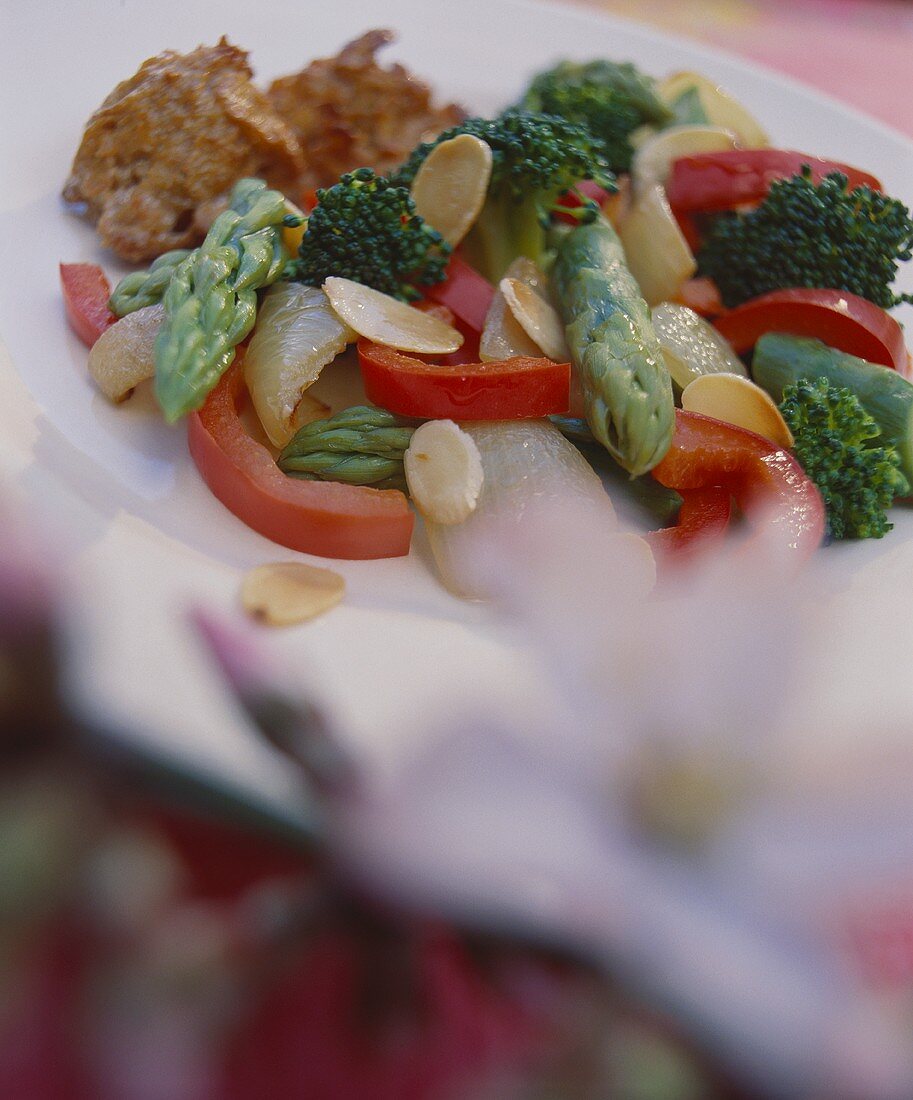 Broccoli, asparagus and peppers with flaked almonds