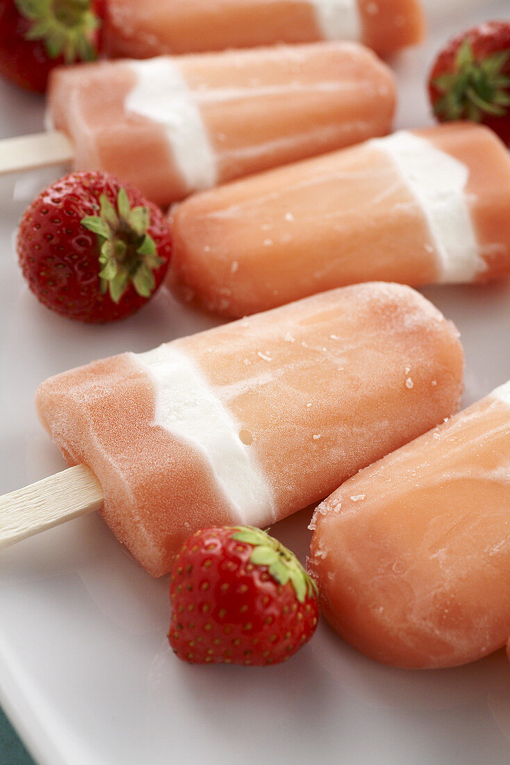 Home-made strawberry ice lollies